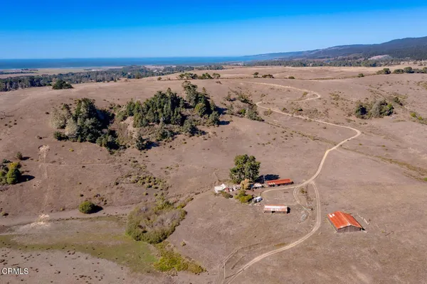 an aerial view of beach and ocean