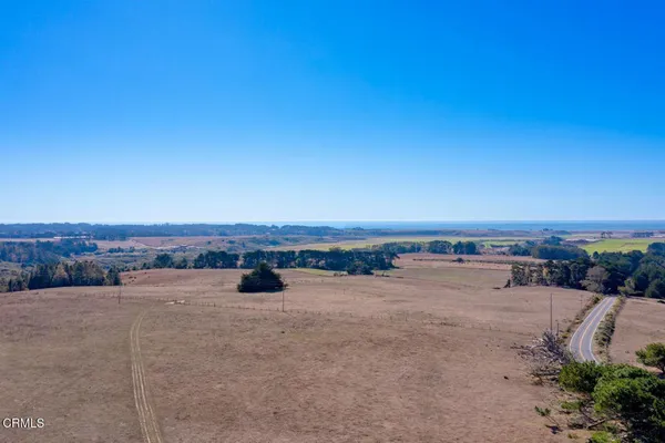 a view of a mountain with a lake view