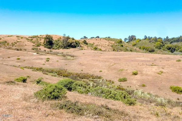 a view of an ocean beach and mountain view