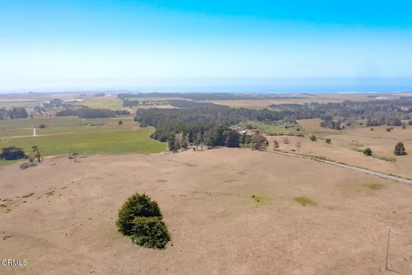 a view of a beach with mountain view