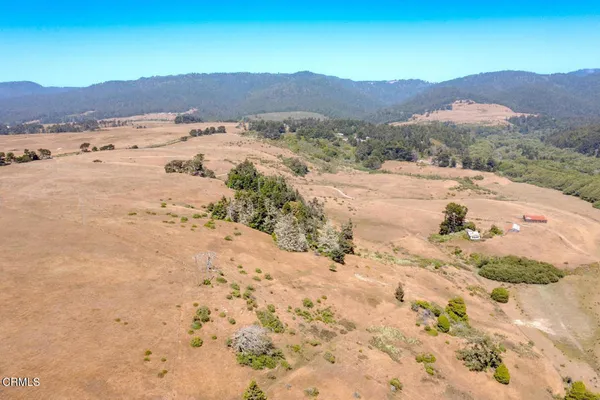 a view of ocean with large building