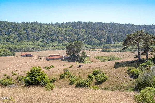 an aerial view of beach and residential space