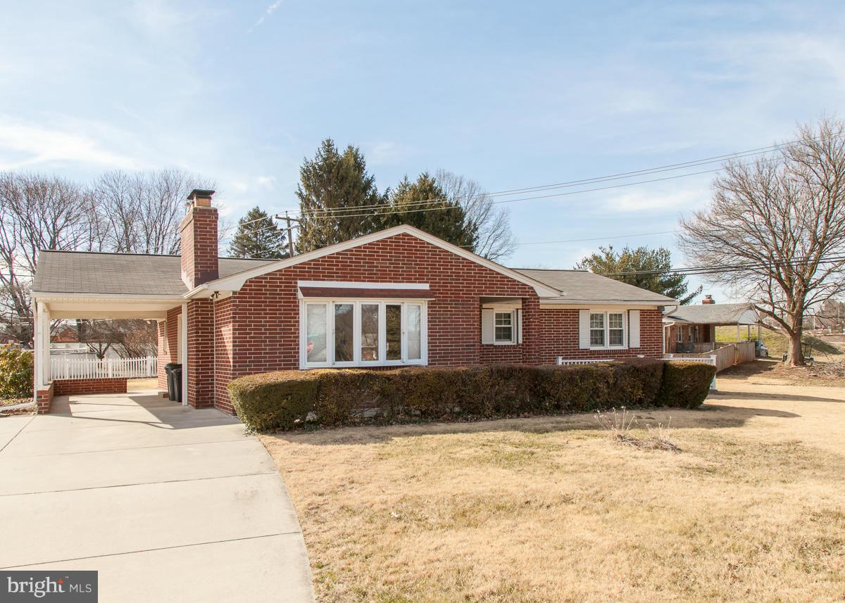 203 Bynum Ridge Road Forest Hill, MD 21050 - Photo 1 of 21 a front view of a house with a yard covered with snow