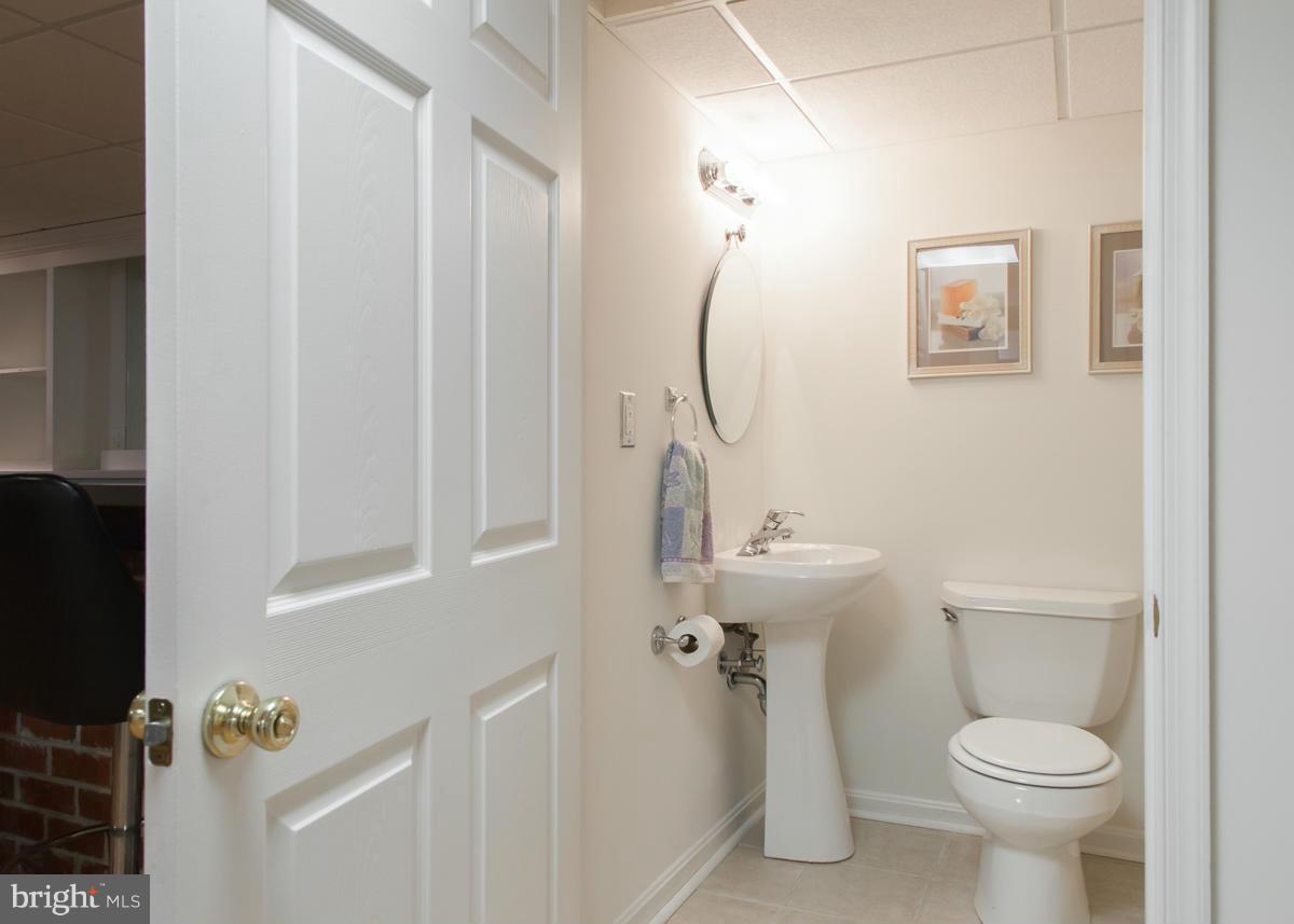 203 Bynum Ridge Road Forest Hill, MD 21050 - Photo 19 of 21 a bathroom with a sink a toilet and shower