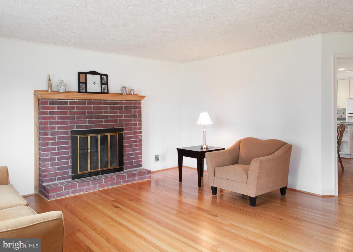 203 Bynum Ridge Road Forest Hill, MD 21050 - Photo 3 of 21 a living room with furniture and a fireplace