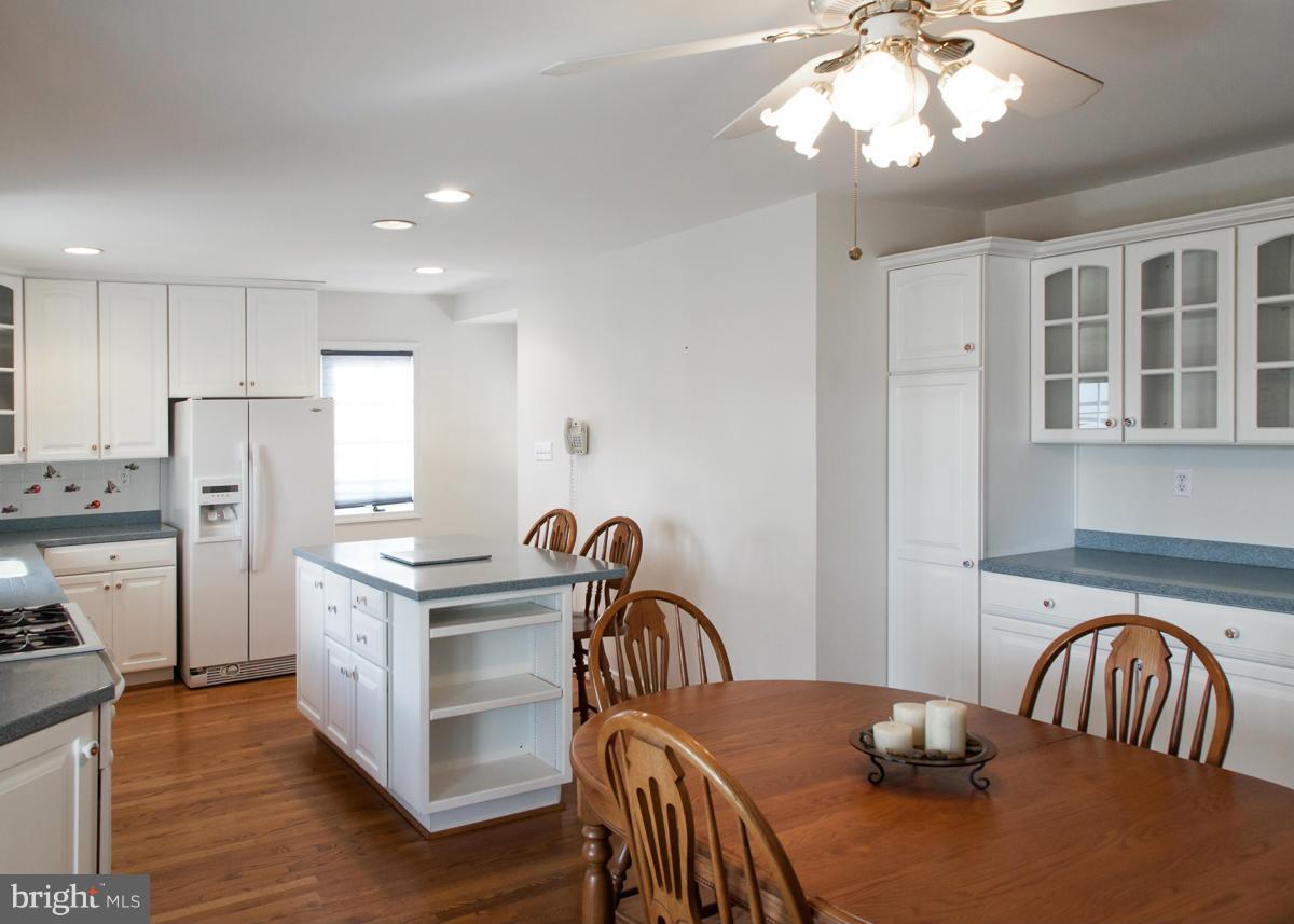 203 Bynum Ridge Road Forest Hill, MD 21050 - Photo 7 of 21 a view of a dining room with furniture a chandelier and wooden floor
