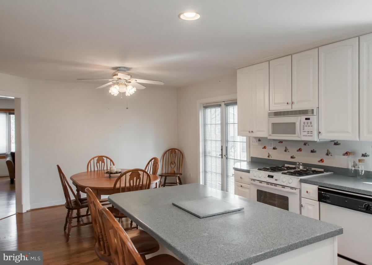 203 Bynum Ridge Road Forest Hill, MD 21050 - Photo 8 of 21 a kitchen with a table and chairs