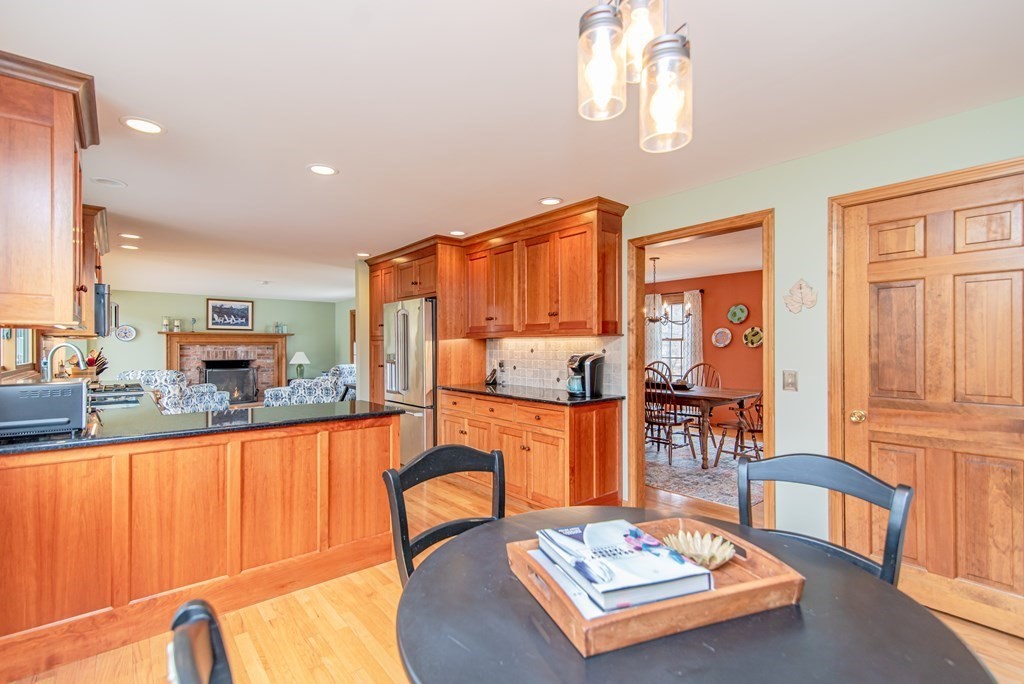 246 Mountain Road Wilbraham, MA 01095 - Photo 15 of 40 a living room with furniture a rug kitchen view and a large window
