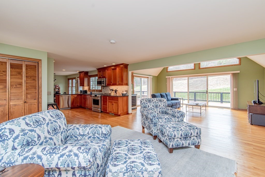 246 Mountain Road Wilbraham, MA 01095 - Photo 7 of 40 a living room with furniture and a large window