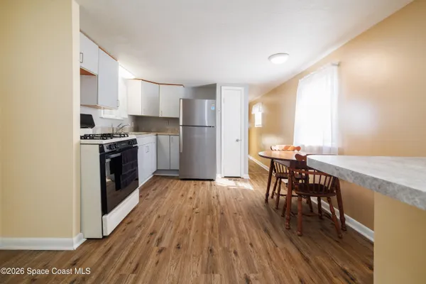 a living room with furniture gym equipment and a flat screen tv