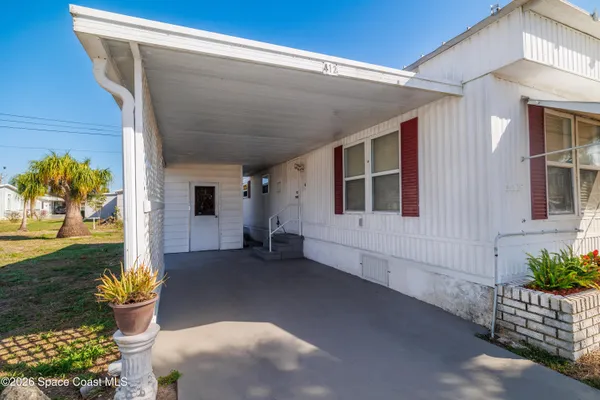 a view of a terrace with outdoor seating and city view
