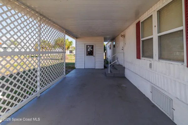 a view of swimming pool with outdoor seating and city view