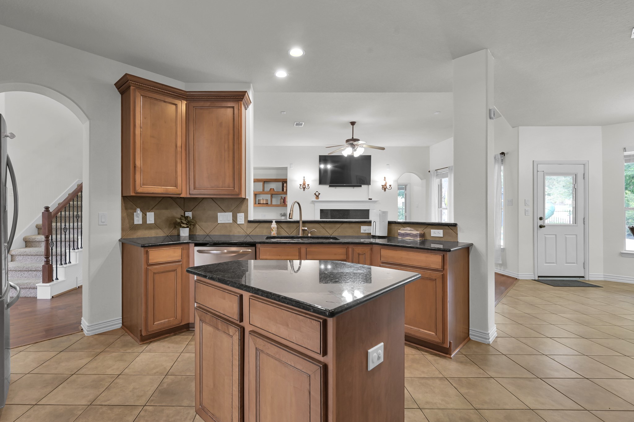 4770 Jackson Square Drive Conroe, TX 77304 - Photo 15 of 48 a kitchen with stainless steel appliances granite countertop a sink a stove a microwave and a refrigerator