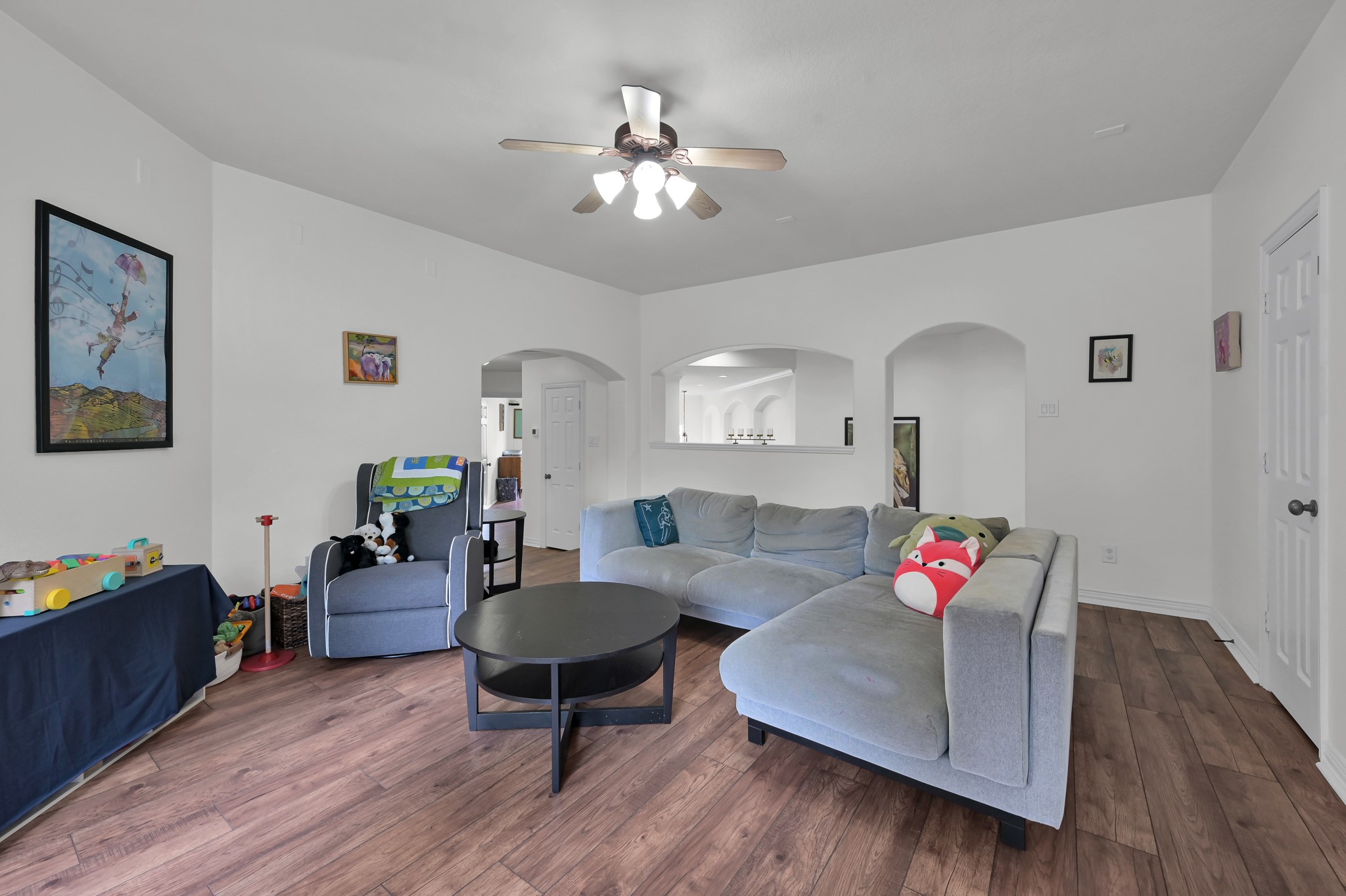 4770 Jackson Square Drive Conroe, TX 77304 - Photo 25 of 48 a living room with furniture and wooden floor