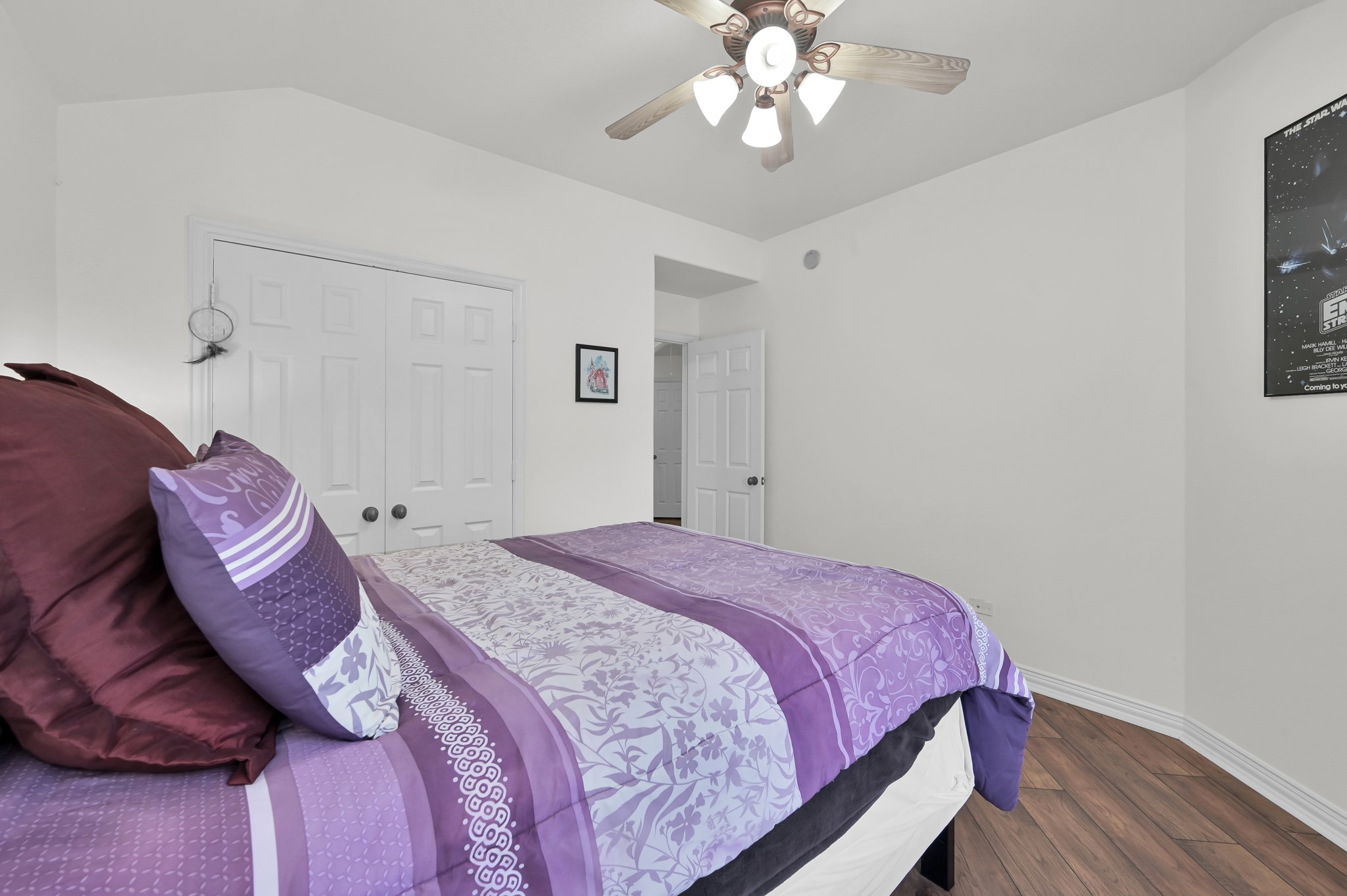 4770 Jackson Square Drive Conroe, TX 77304 - Photo 28 of 48 a bedroom with a bed and wooden floor