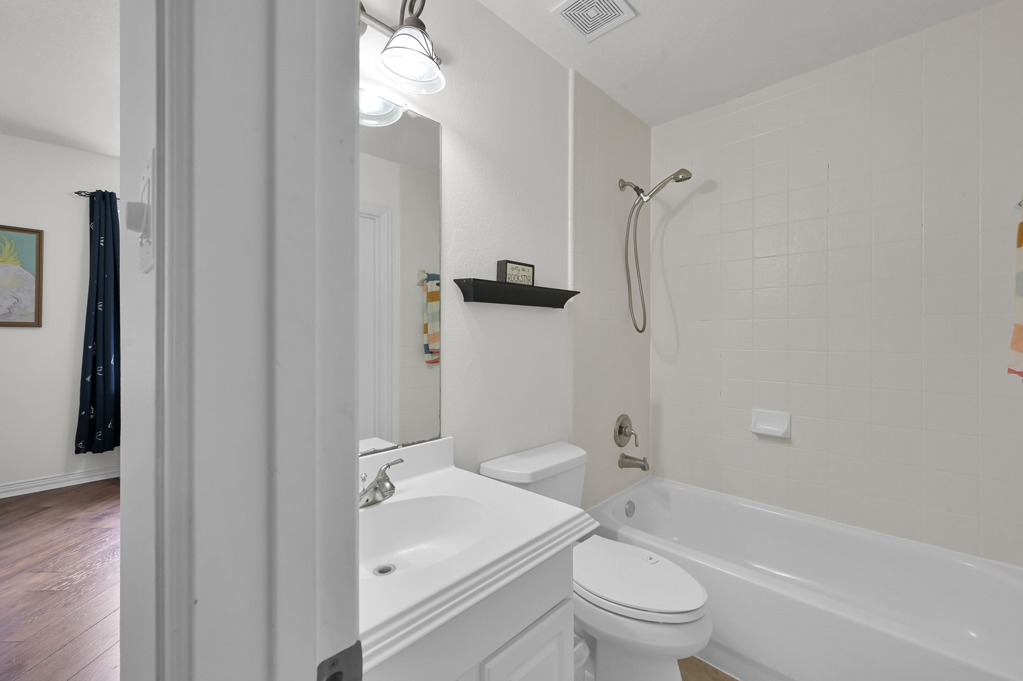 4770 Jackson Square Drive Conroe, TX 77304 - Photo 32 of 48 a bathroom with a sink toilet and shower