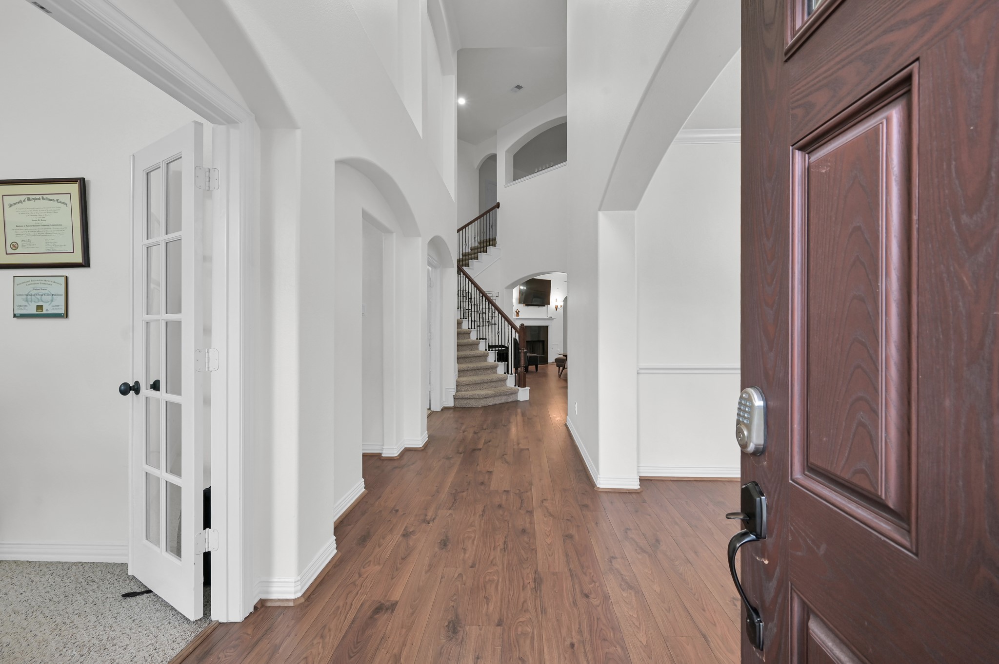 4770 Jackson Square Drive Conroe, TX 77304 - Photo 4 of 48 a view of hallway with wooden floor and stairs