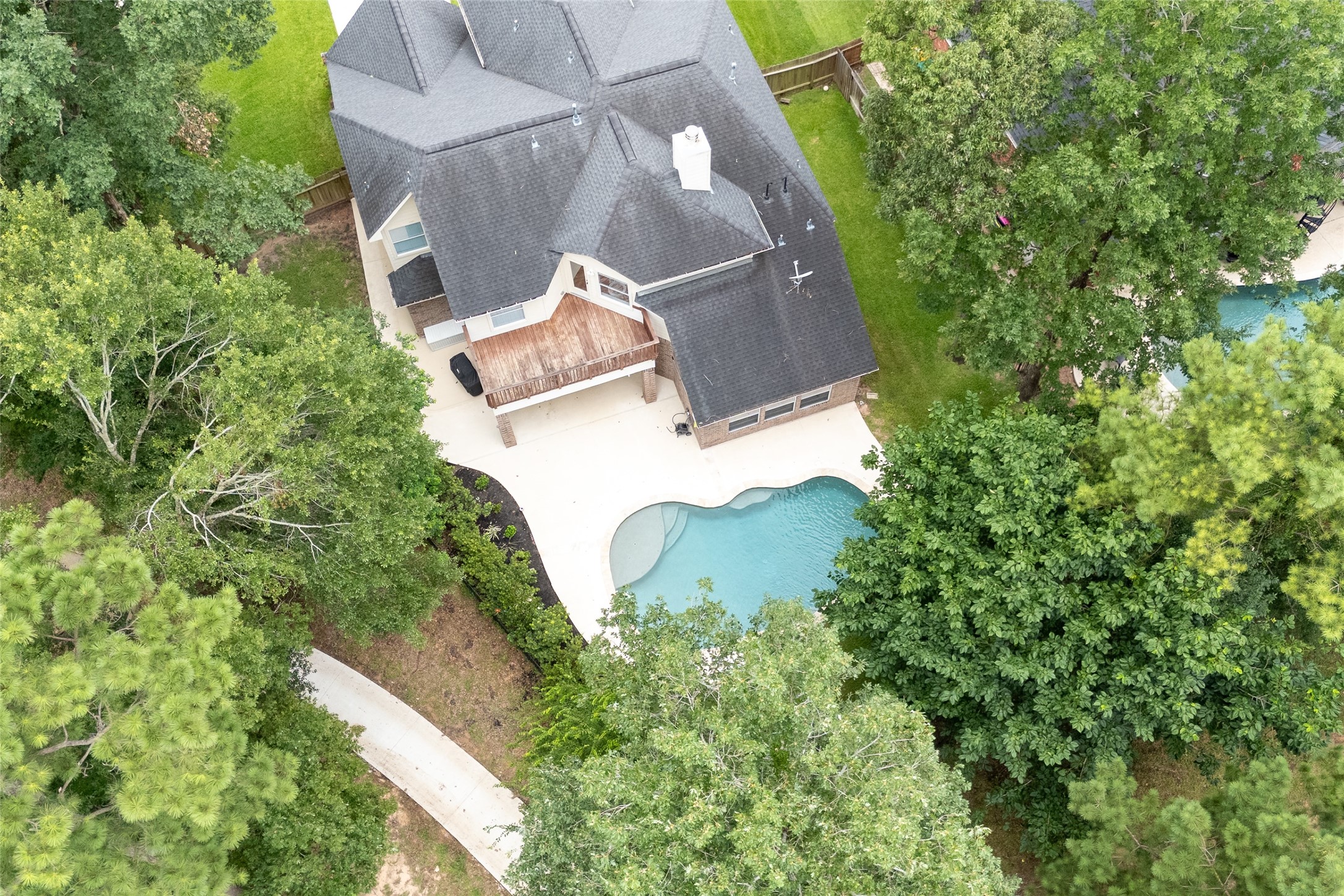 4770 Jackson Square Drive Conroe, TX 77304 - Photo 43 of 48 an aerial view of a house with a yard and garden
