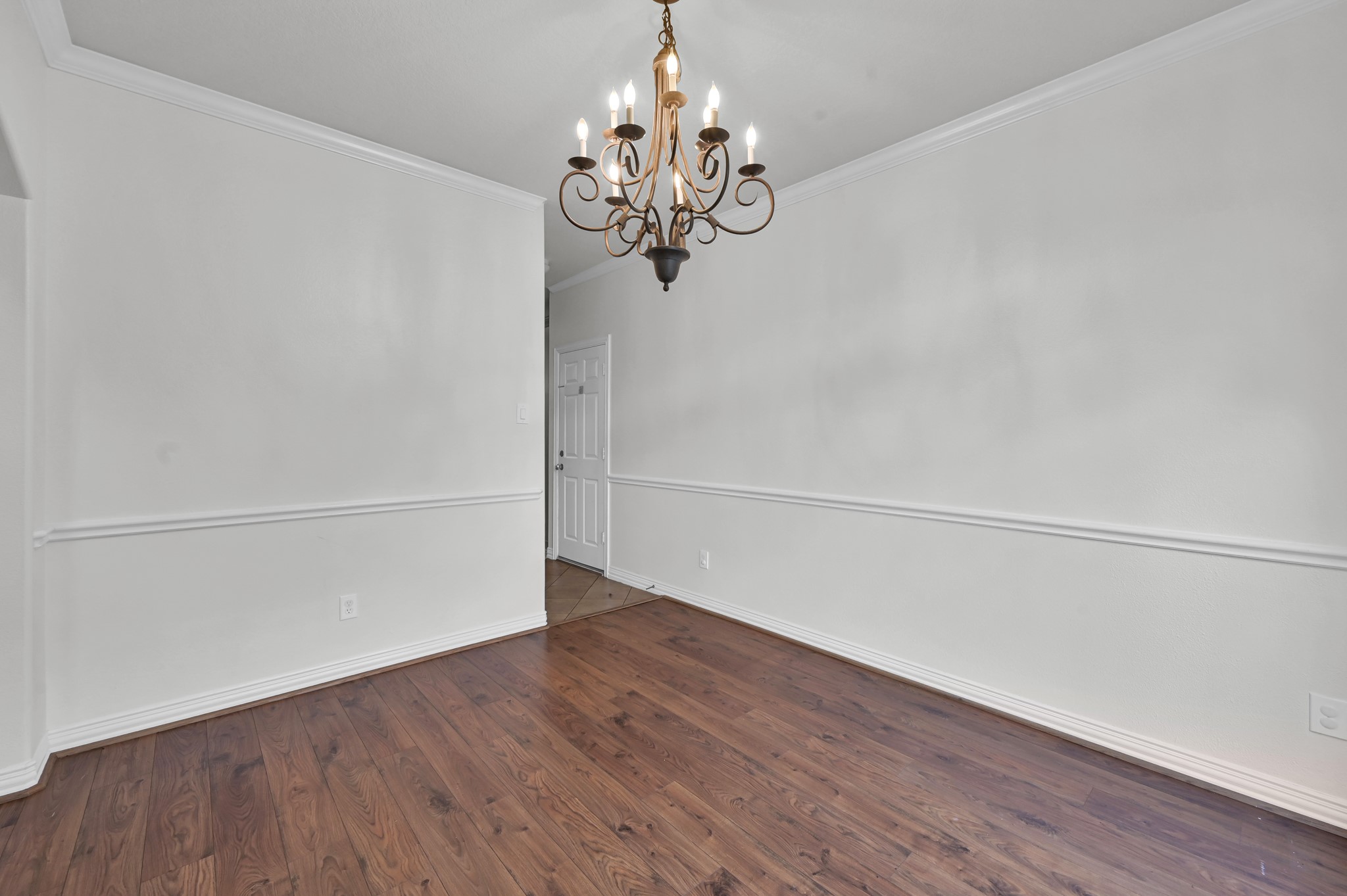 4770 Jackson Square Drive Conroe, TX 77304 - Photo 9 of 48 a view of a chandelier in an empty room