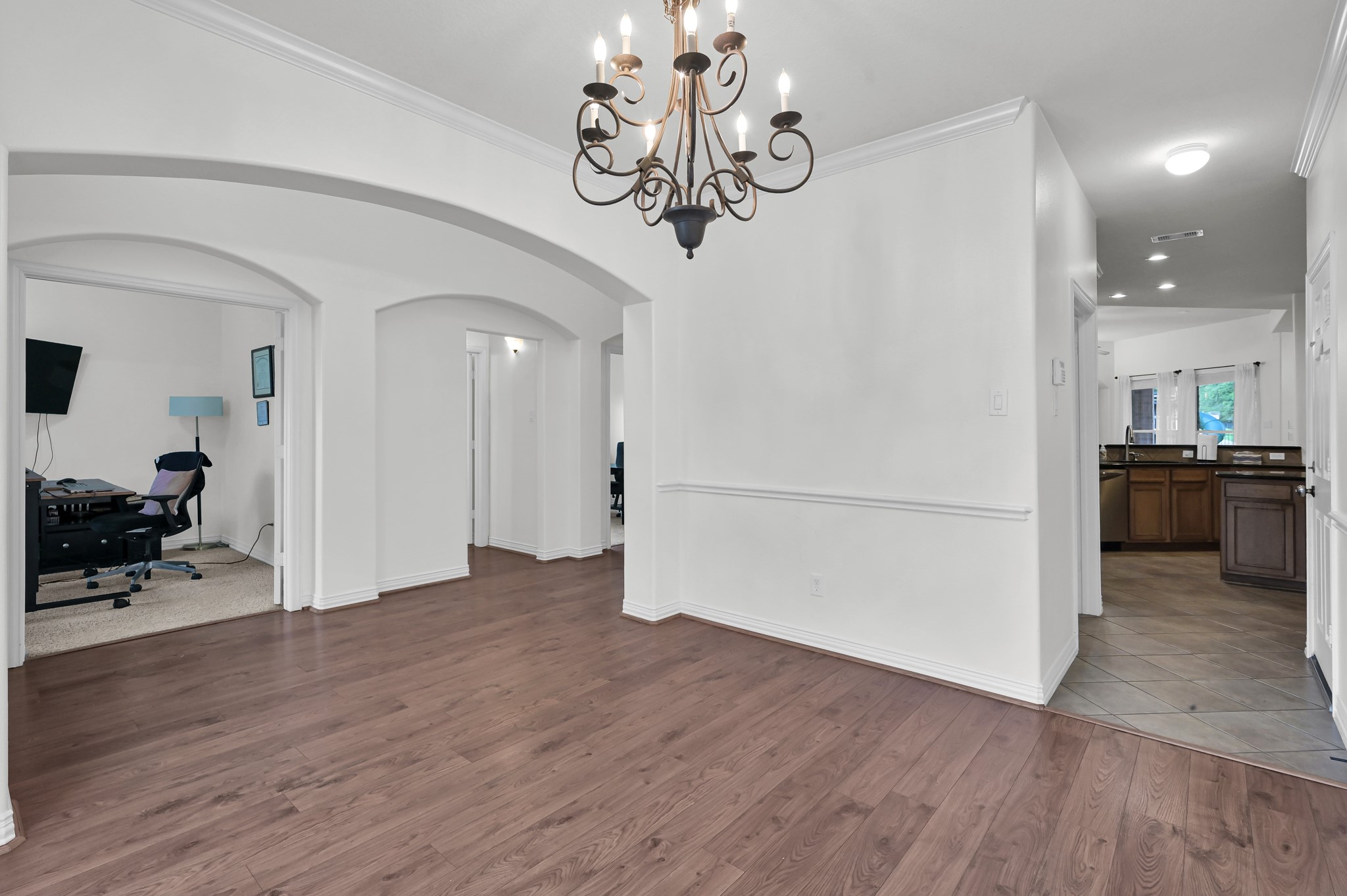 4770 Jackson Square Drive Conroe, TX 77304 - Photo 10 of 48 a view of a hallway with wooden floor