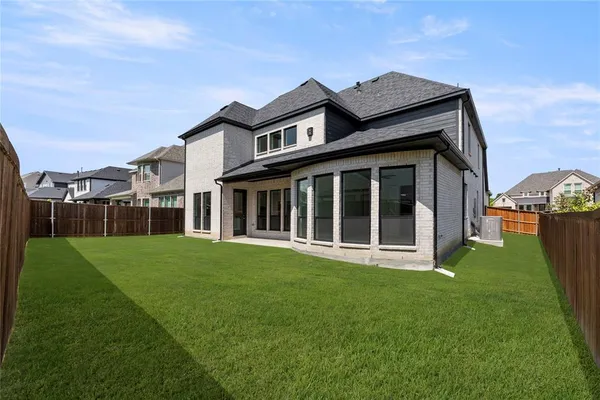 a big house with a big yard and more windows