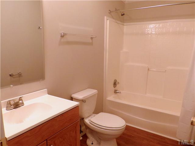 295 Massengill Pond Road Angier, NC 27501 - Photo 20 of 25 a bathroom with a sink toilet and shower