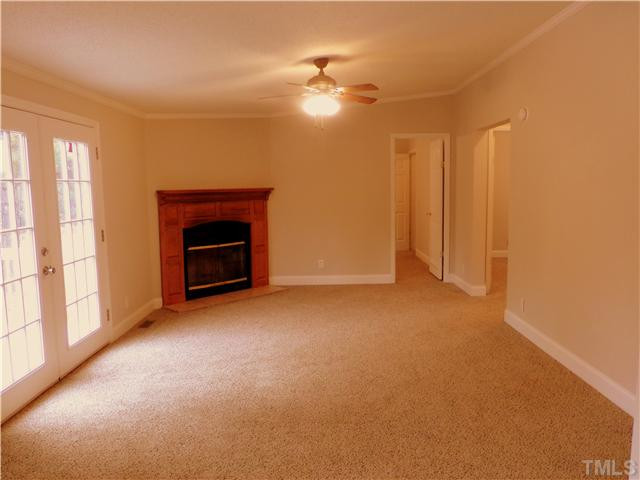 295 Massengill Pond Road Angier, NC 27501 - Photo 3 of 25 a view of empty room with a fireplace