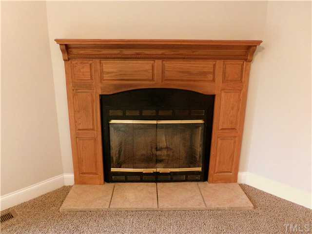 295 Massengill Pond Road Angier, NC 27501 - Photo 4 of 25 a living room with a fireplace