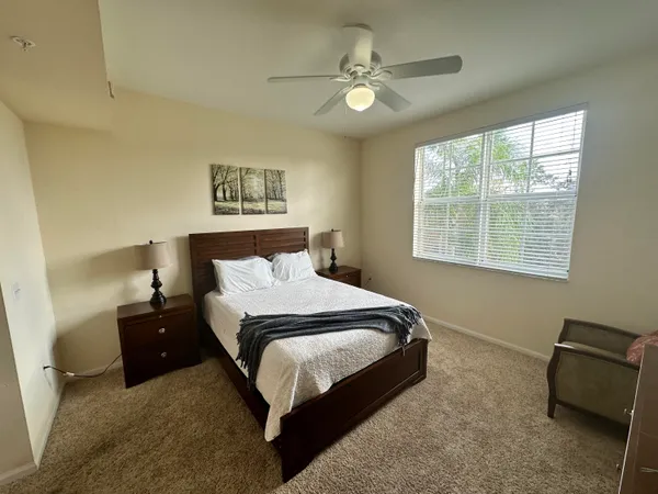 a bedroom with a bed and a couch