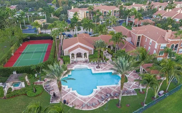 an aerial view of house with yard swimming pool and outdoor seating