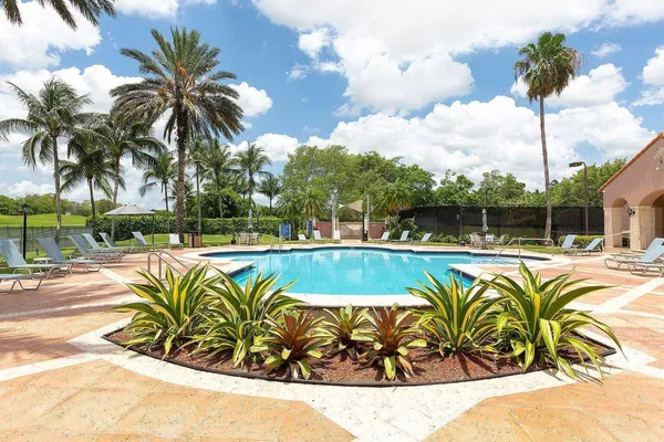 a view of swimming pool with a table and chairs