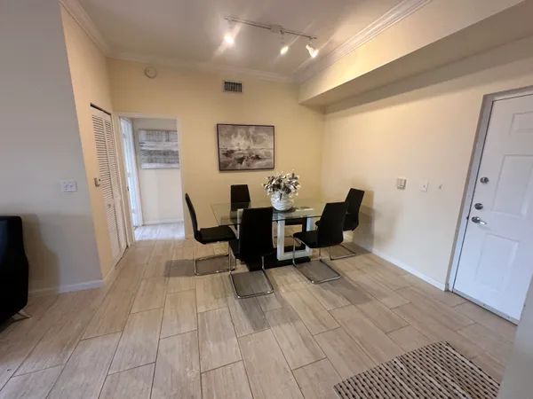 a living room with furniture and a rug