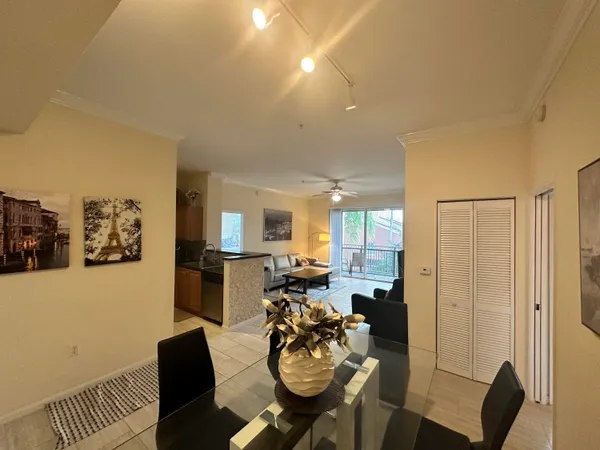a view of a livingroom with furniture and a window