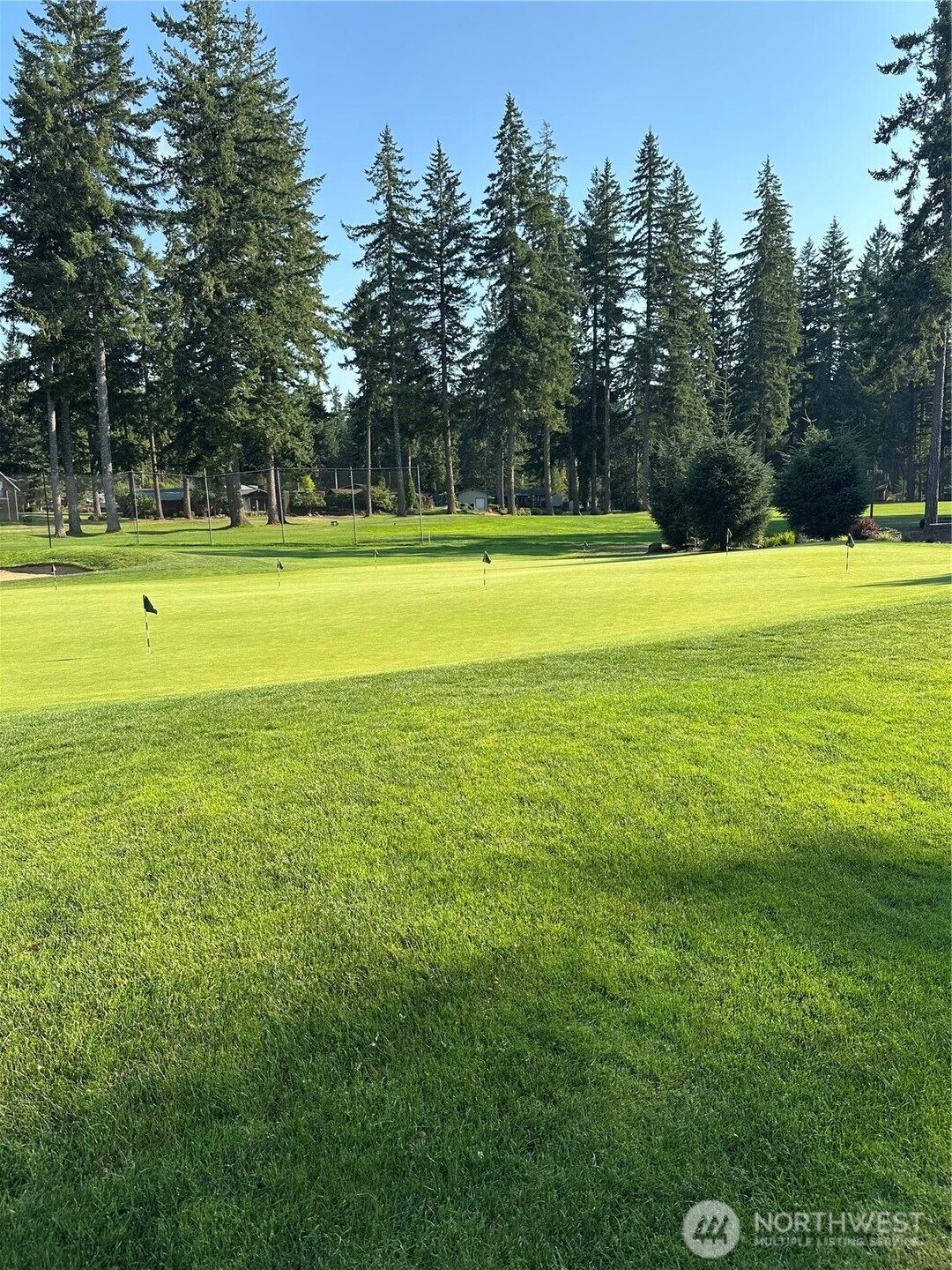 700 East Vine Maple Lane Union, WA 98592 - Photo 2 of 14 a view of a swimming pool with an outdoor space and seating area