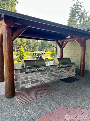 a large dining space with furniture a chandelier and window