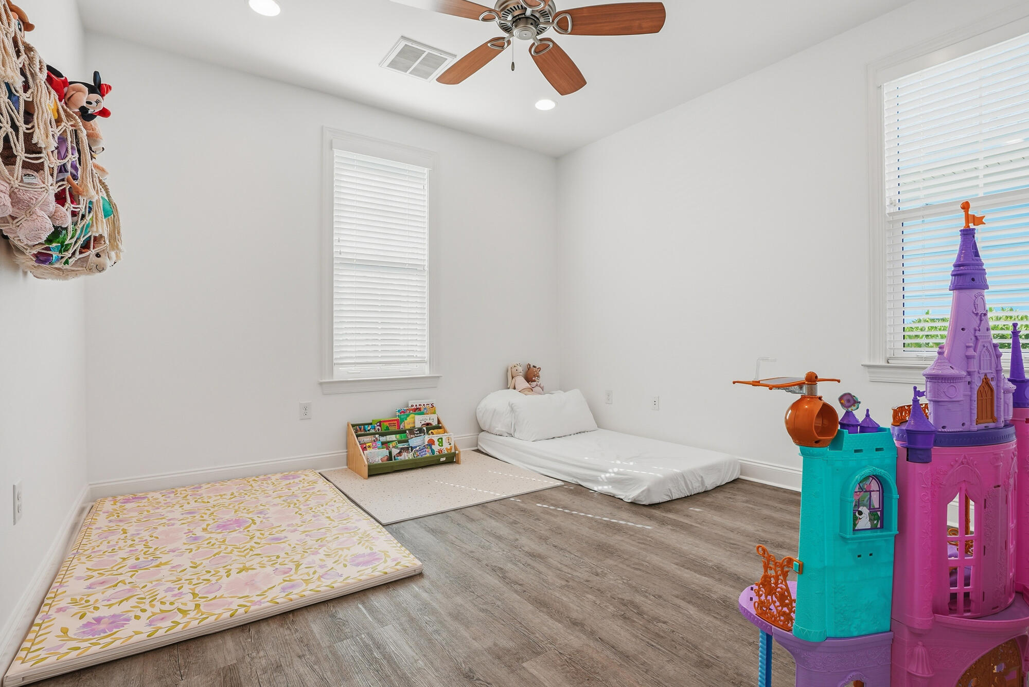 199 Windrow Way Inlet Beach Inlet Beach, FL 32461 - Photo 16 of 24 a bedroom with a bed and a chandelier
