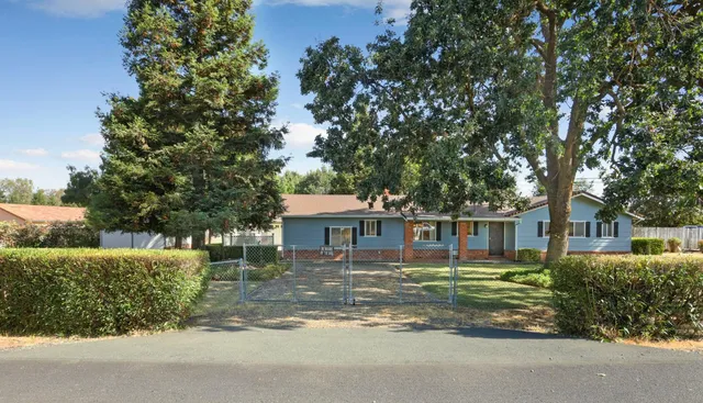 front view of a house with a garden
