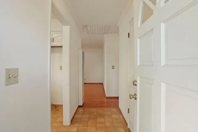 a view of a hallway with a white walls