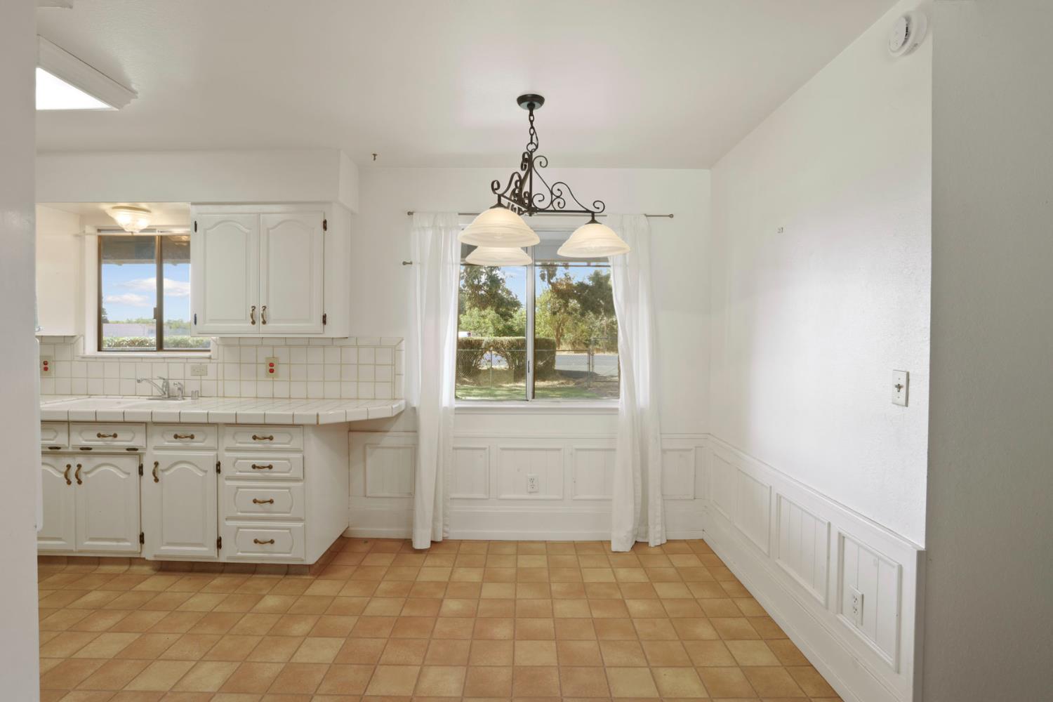 13495 Live Oak Road Lodi, CA 95240 - Photo 21 of 47 a bathroom with a granite countertop sink a mirror and a bathtub