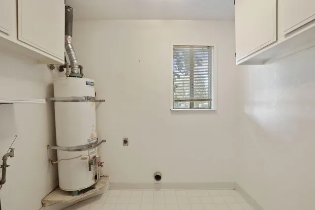 a bathroom with a white tub and a shower