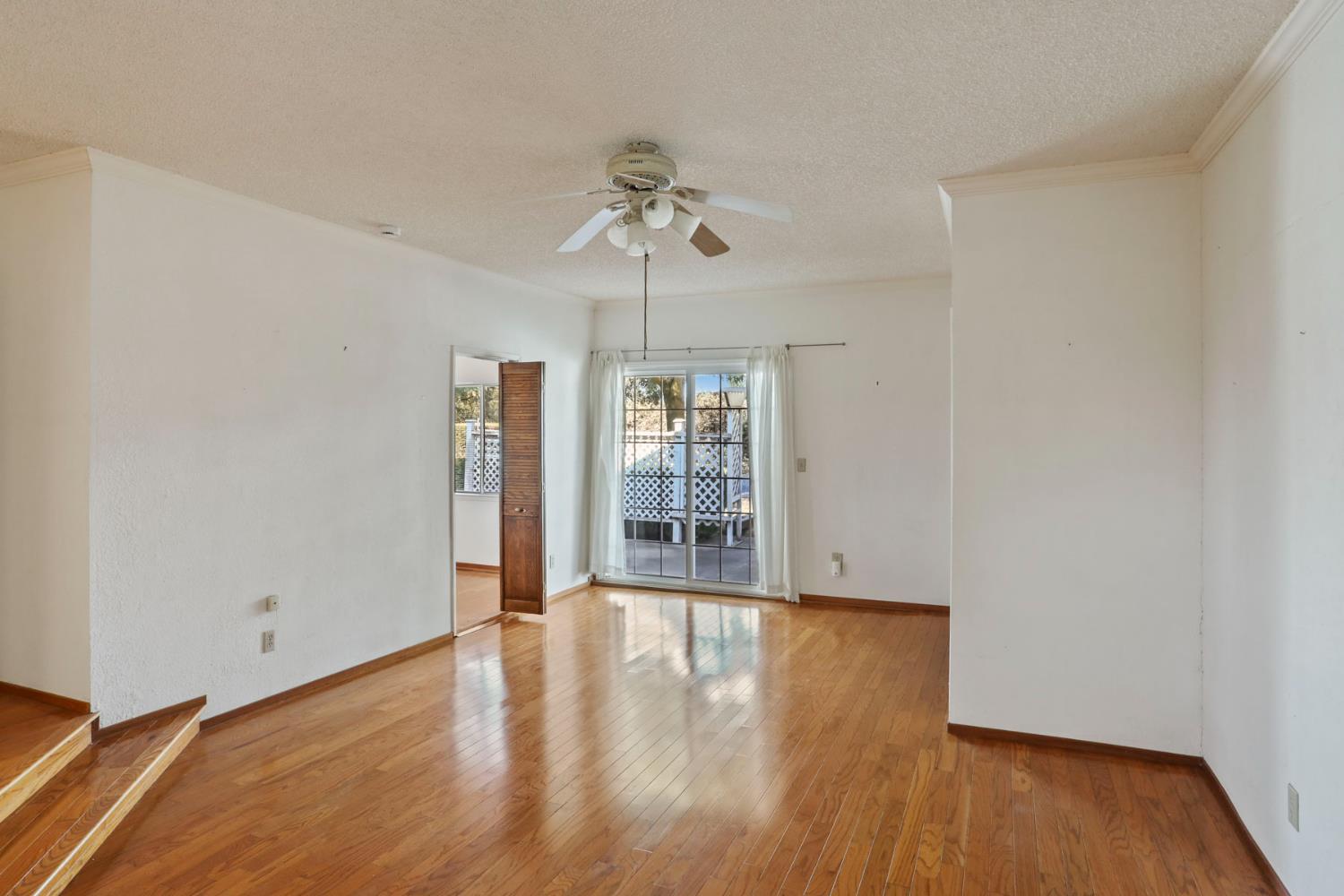 13495 Live Oak Road Lodi, CA 95240 - Photo 25 of 47 wooden floor in an empty room with a window