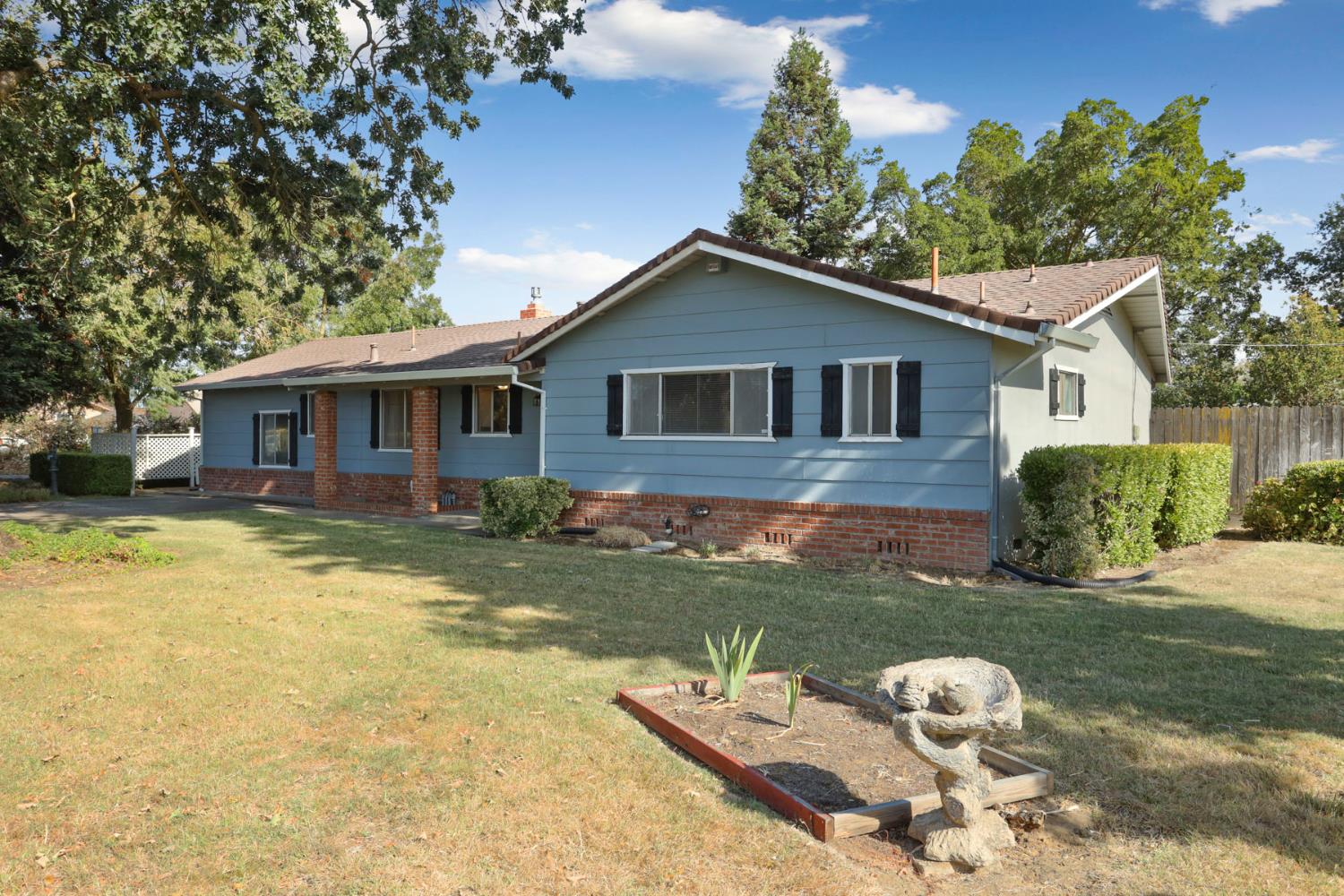 13495 Live Oak Road Lodi, CA 95240 - Photo 3 of 47 a view of a house with a yard balcony and a tree