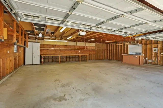a view of an empty room with wooden walls