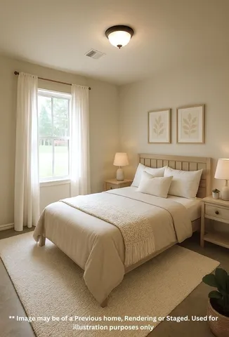 a bedroom with a bed and a night stand