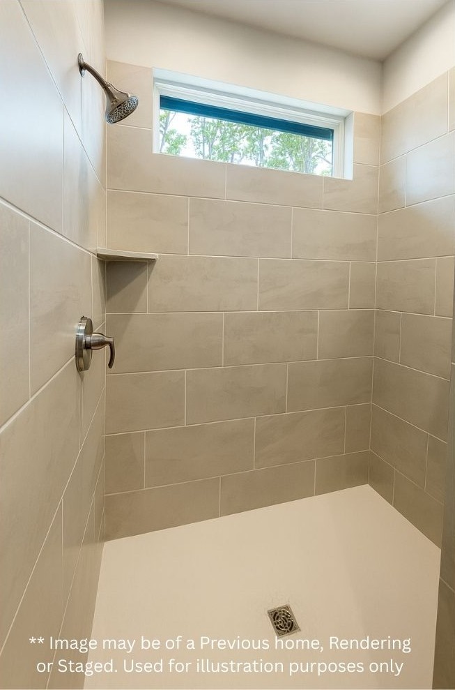 15506 Arrowhead Loop West Willis, TX 77378 - Photo 7 of 13 a bathroom with a shower