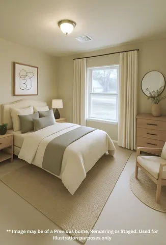 a bedroom with a bed and painting on the wall