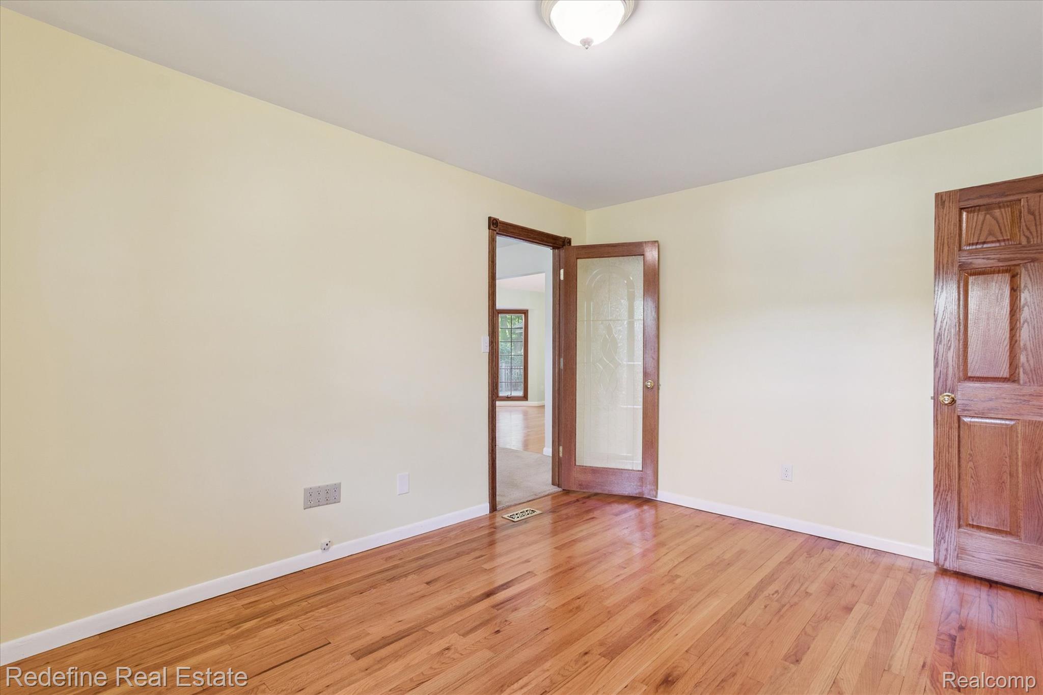 3777 Dorr Road Brighton, MI 48116 - Photo 31 of 77 Empty room featuring light wood finished floors and baseboards