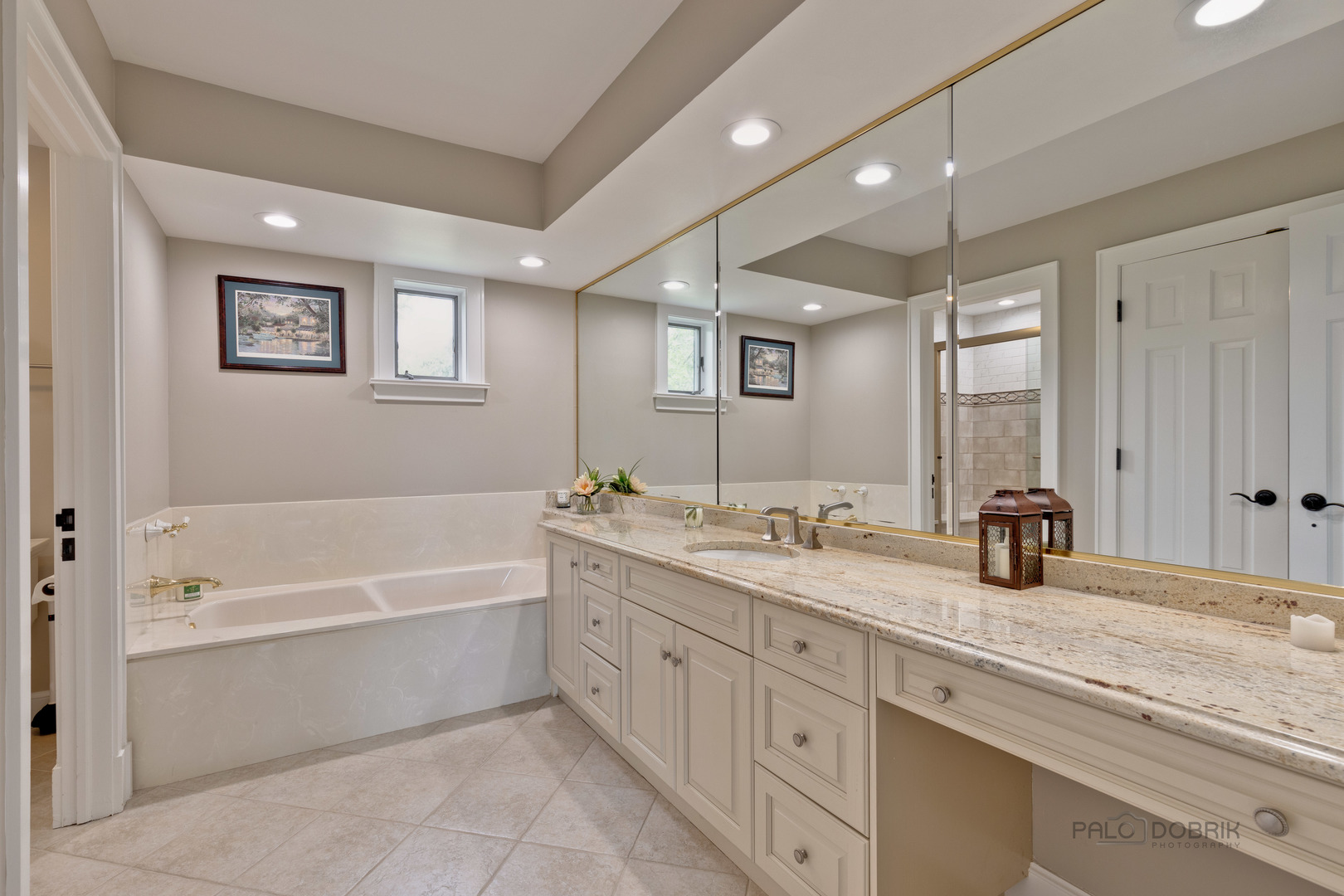 575 West Windsor Road Inverness, IL 60067 - Photo 23 of 54 a bathroom with a granite countertop sink mirror and bathtub
