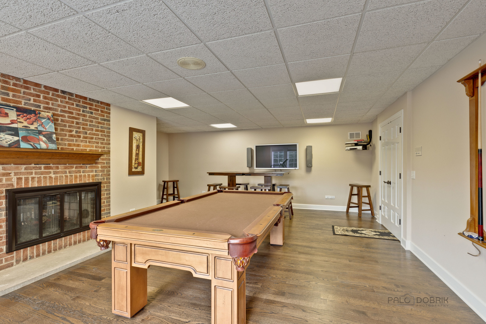 575 West Windsor Road Inverness, IL 60067 - Photo 45 of 54 a living room with stainless steel appliances furniture a fireplace and a wooden floor