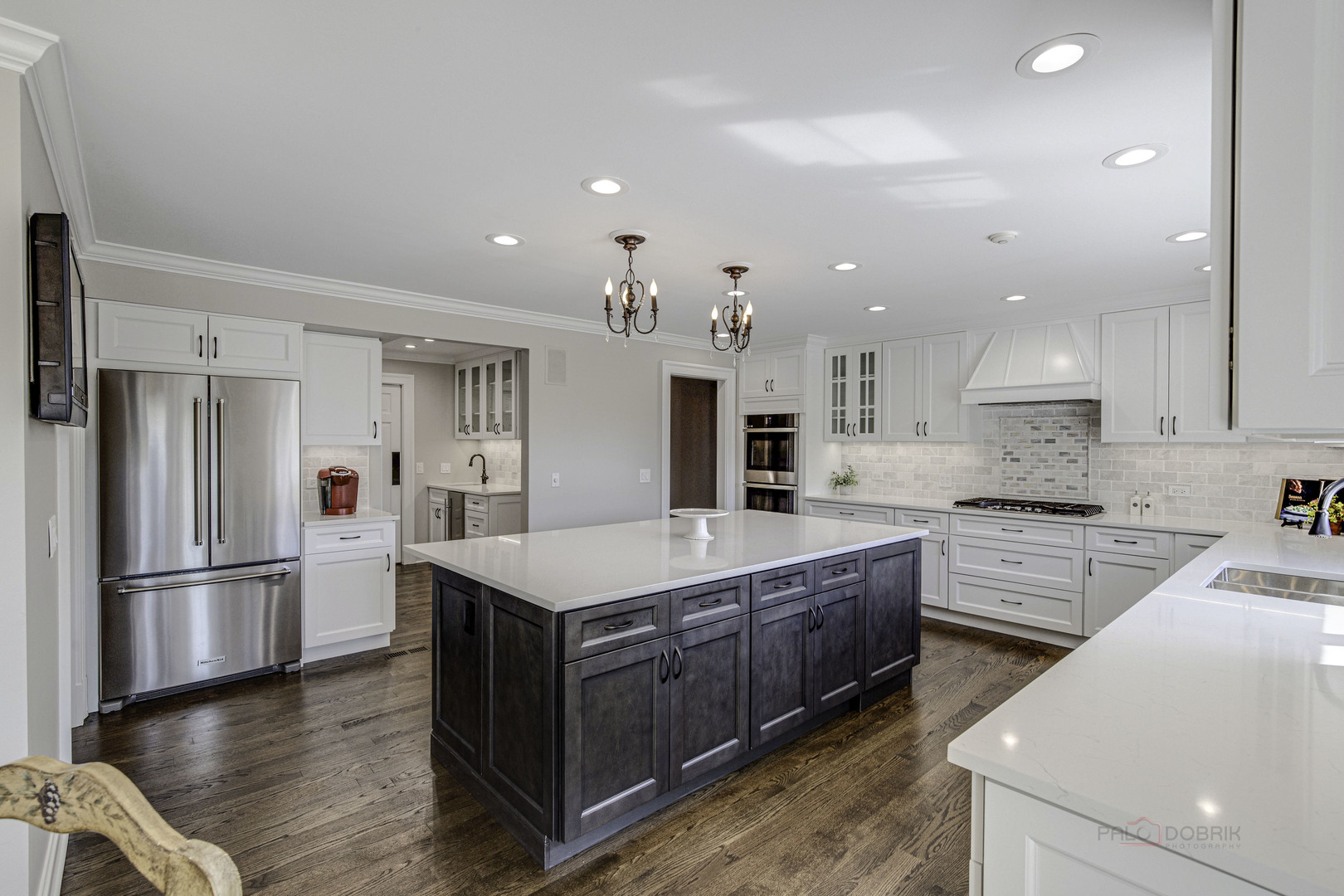 575 West Windsor Road Inverness, IL 60067 - Photo 7 of 54 a large kitchen with stainless steel appliances kitchen island a large counter top and a refrigerator